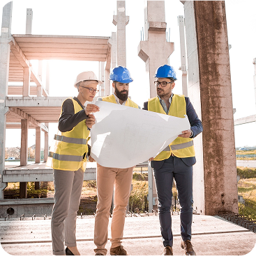Construction team looking at blueprints